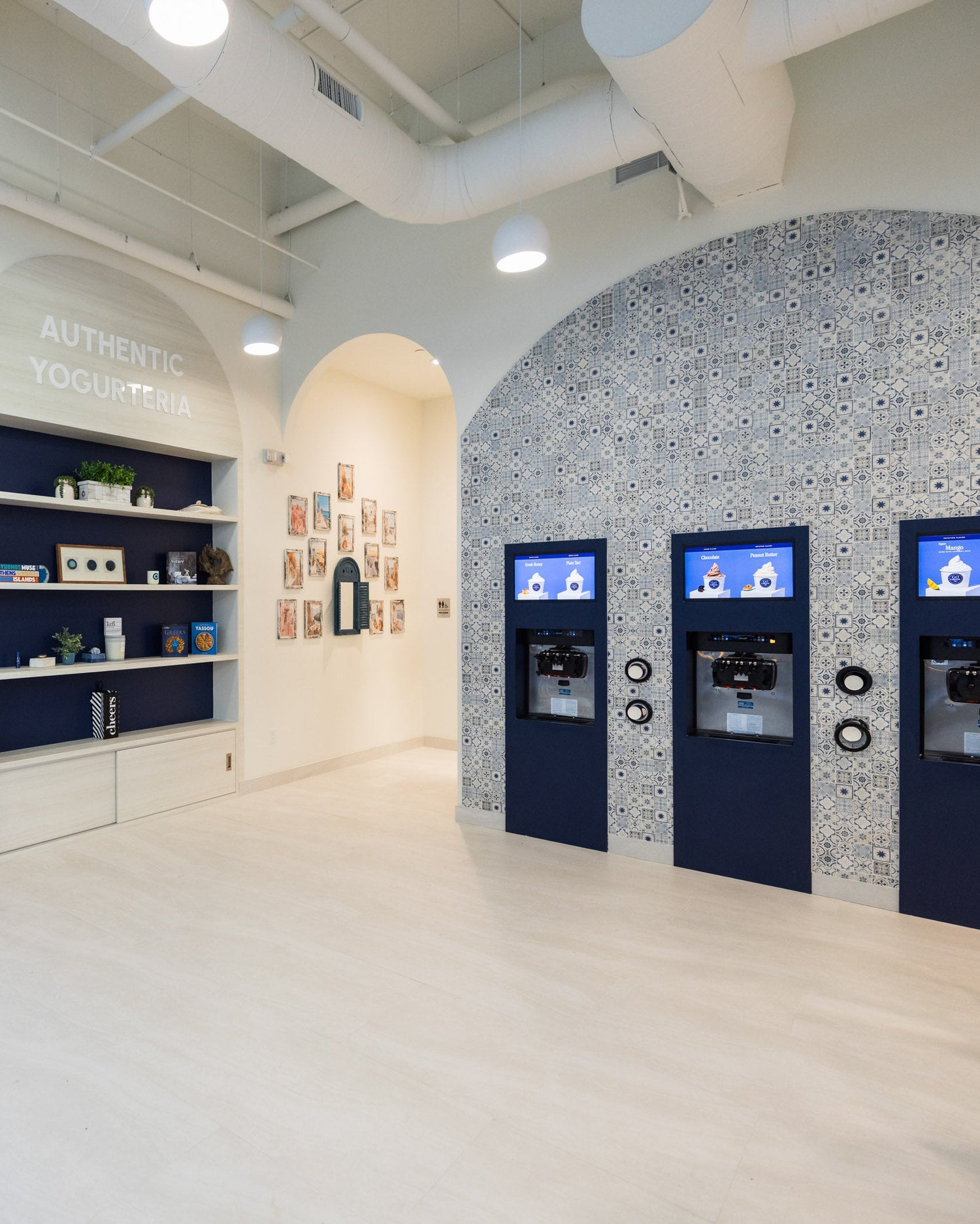 Modern interior with decorative elements and automated teller machines.