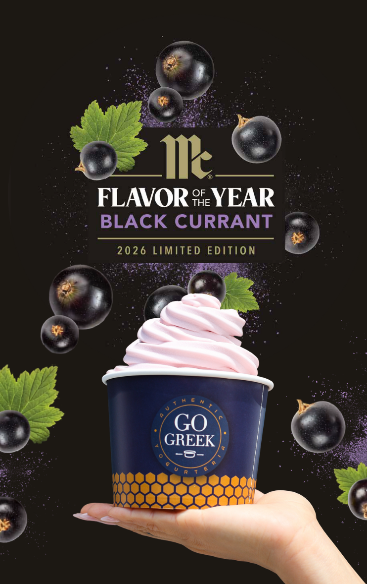 A hand holds a cup of pink soft-serve ice cream topped with a blackcurrant swirl, set against a dark background with floating blackcurrants, leaves, and the text 'Flavor of the Year Black Currant 2026 Limited Edition', the McCormick logo, and the GO GREEK logo.